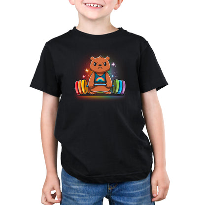 A child is wearing a black Gym Bear t-shirt made of super soft ringspun cotton from monsterdigital, featuring an illustration of a bear lifting colorful weights. The bear appears determined and focused. The child is smiling and has their hands resting to the sides, enjoying the unisex tee's comfort.