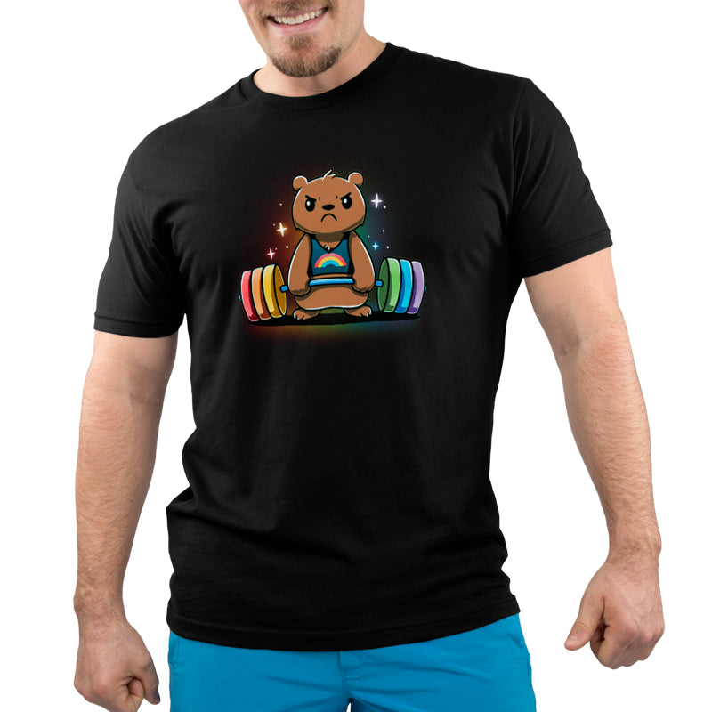 A person wearing a super soft ringspun cotton black Gym Bear t-shirt by monsterdigital, featuring an illustration of an angry bear lifting a colorful barbell. The person is also sporting blue shorts.