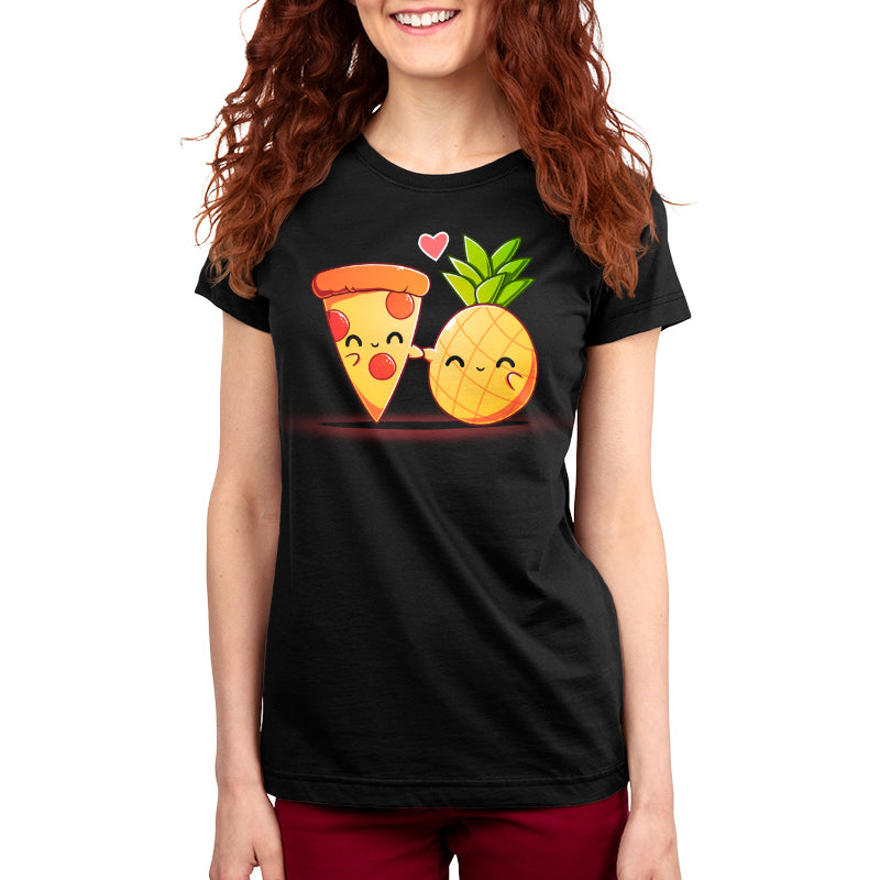 Premium Cotton T-shirt - A woman is wearing a monsterdigital Hawaiian Pizza Black 100% Super Soft Ringspun Cotton Unisex apparelwith a graphic depicting a smiling pizza slice and a smiling pineapple with a heart above them. She has long, wavy red hair.