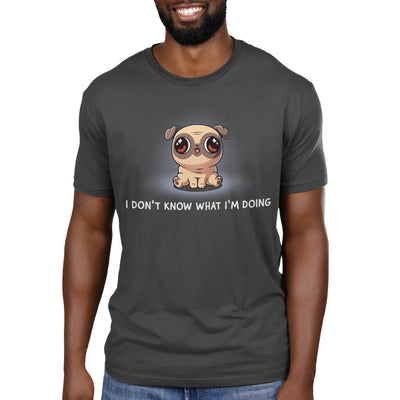 Premium Cotton T-shirt_TeeTurtle charcoal gray I Don’t Know What I’m Doing apparel featuring a sitting pug with large eyes looking in different directions.