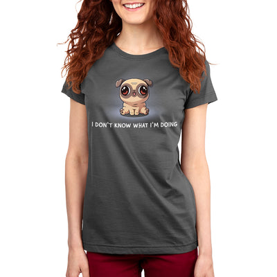 Premium Cotton T-shirt_TeeTurtle charcoal gray I Don’t Know What I’m Doing apparel featuring a sitting pug with large eyes looking in different directions.