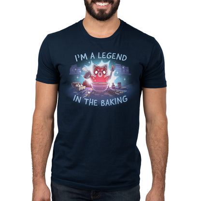 Premium Cotton T-shirt_TeeTurtle navy blue I'm a Legend in the Baking apparel featuring a red panda with lit up eyes holding a spatula and hand mixer in a kitchen surrounded by baking equipment, such as a sheet of cookies, eggs, and flour.