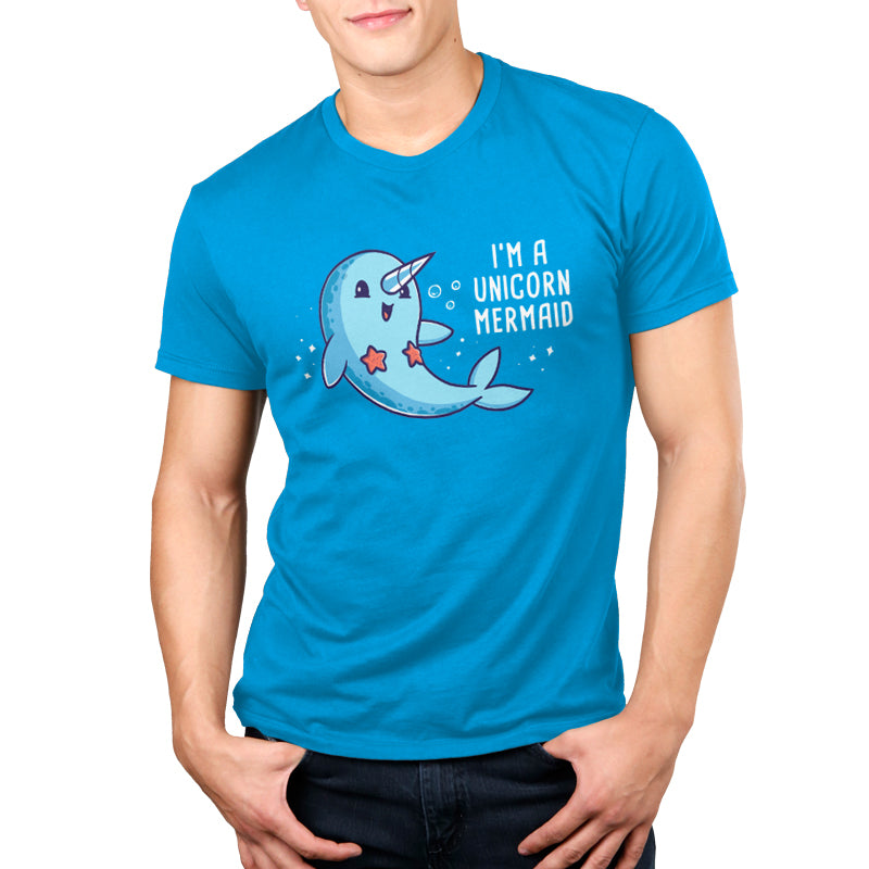 Teeturtle Cobalt Blue I'm a Unicorn Mermaid Premium Cotton T-shirt. Featuring a cute, smiling Narwhal wearing a pair of starfish on its chest while swimming in the ocean with sparkles and bubbles