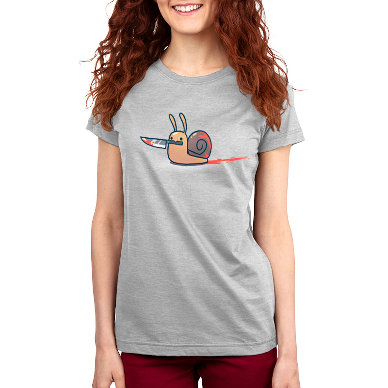 A woman wearing a gray women's t-shirt with a cartoon design of a Killer Snail holding a pen by monsterdigital.