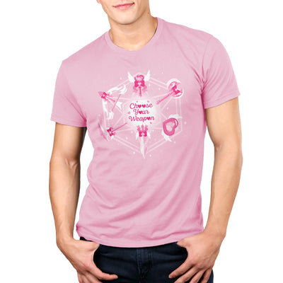 Premium Cotton T-shirt_TeeTurtle light pink Magical Weaponry apparel featuring a D20 with various magical weapons at the intersecting points with the caption, "Choose Your Weapon" in the center.