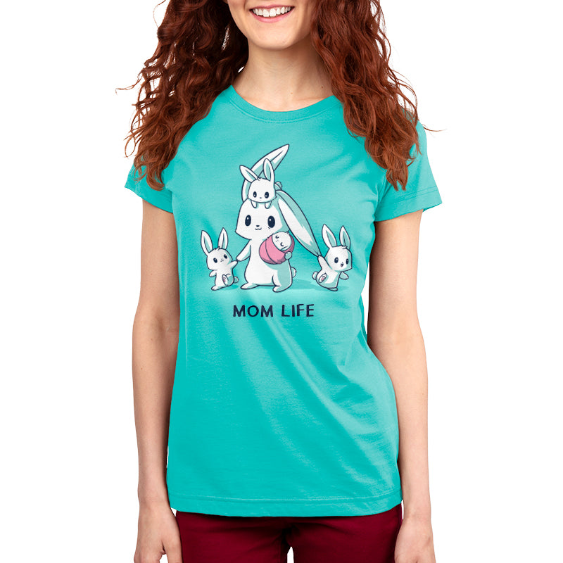A woman in a Caribbean Blue monsterdigital Mom Life shirt with cartoon bunnies and the text "MOM LIFE" stands against a white background.