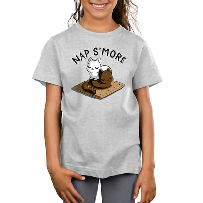 A child wearing a gray monsterdigital Nap S’more shirt featuring an illustration of a kitty cuddles with a s'more and the text "Nap S'more.