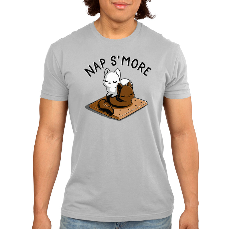 Person wearing a light gray monsterdigital Nap S'more T-shirt featuring a drawing of two marshmallow cats napping on a chocolate and graham cracker. Text above reads "NAP S'MORE." Perfect for those who love kitty cuddles.