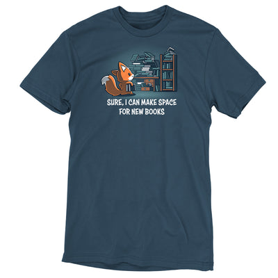 Premium Cotton T-shirt_TeeTurtle denim blue Never-Ending Bookshelf apparel featuring a fox holding a book standing in front of an overflowing book and desk with the caption, “Sure, I can Make Space for New Books“.