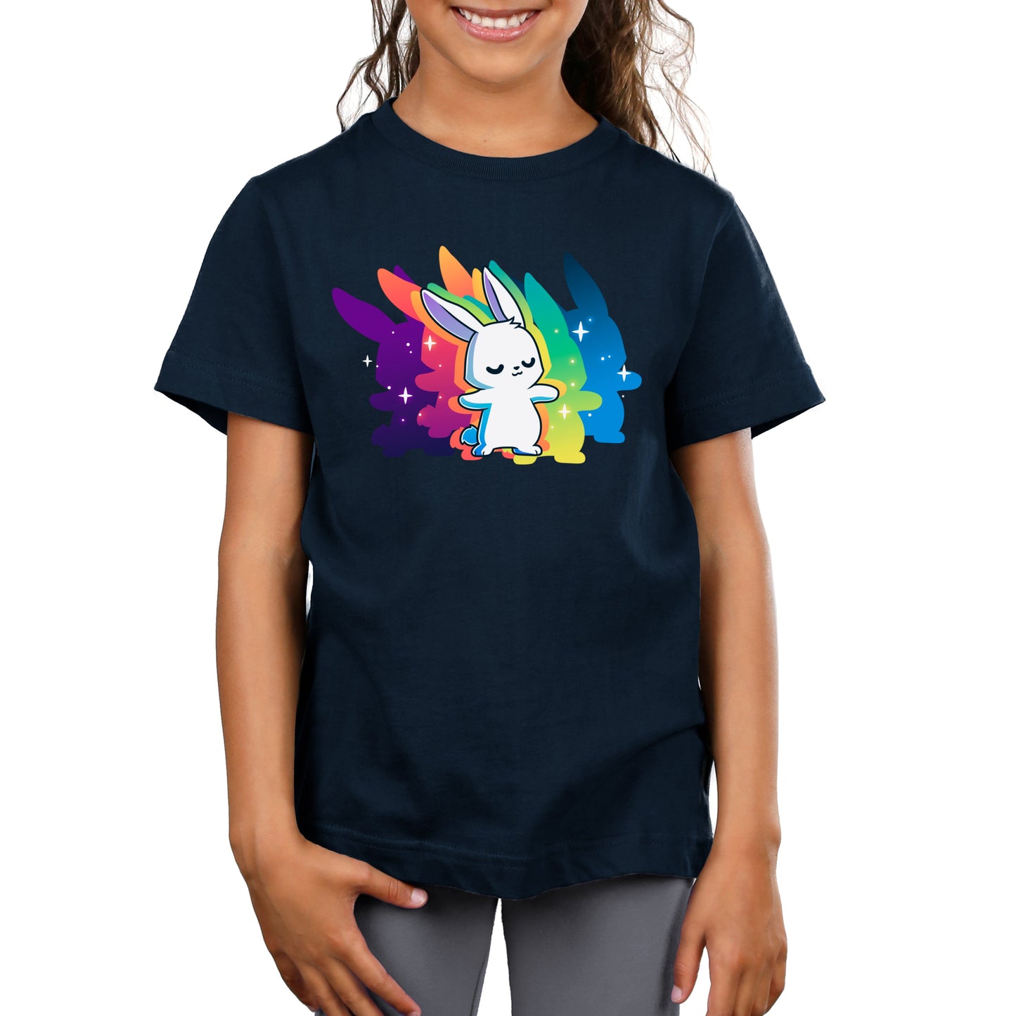 A child wearing a navy blue t-shirt made from super soft ringspun cotton, featuring a graphic of Queer Vibes Only by monsterdigital, standing confidently in front of a vibrant, multicolored background.