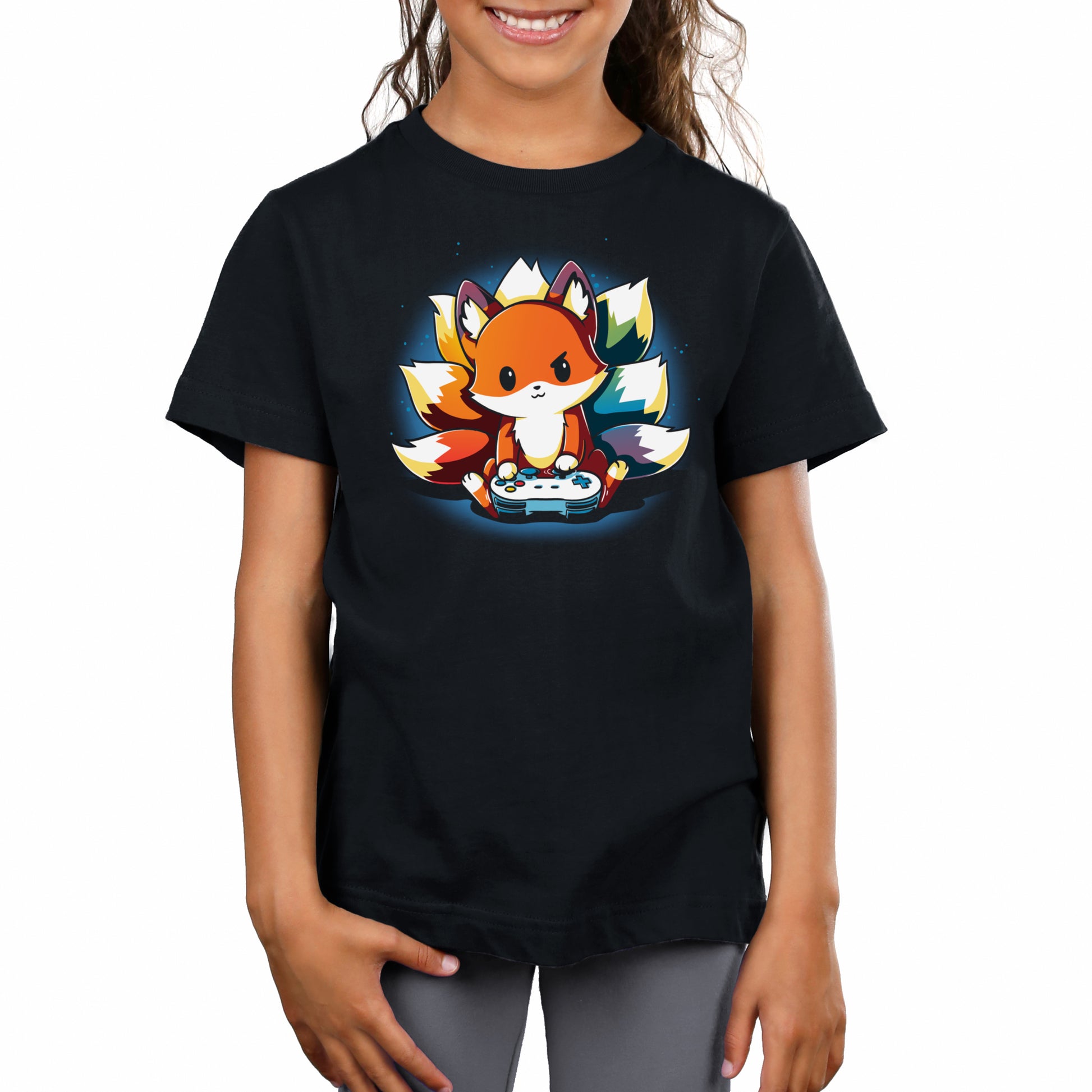 A child wearing a super soft ringspun cotton, unisex tee featuring a cartoon fox playing a video game against a colorful background. This Rainbow Gamer by monsterdigital is perfect for any young gaming enthusiast.