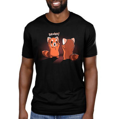 Premium Cotton T-shirt - A person wearing a black apparel featuring a cartoon red panda with the text "RAWRR!" This unisex apparelfrom monsterdigital, named Rawrr!, is made from super soft ringspun cotton, ensuring both comfort and style.