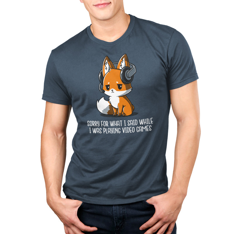 Premium Cotton T-shirt - A person wearing a denim blue monsterdigital Sorry For What I Said apparel with a graphic of a fox wearing headphones and the text "Sorry for what I said while I was playing video games." The Super Soft Ringspun Cotton fabric adds to the comfort.