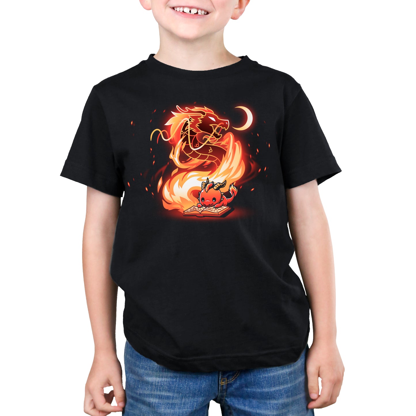 Premium Cotton T-shirt_TeeTurtle Tale Of Scales black t-shirt featuring an illustration of a little red dragon reading a book that has a large, fiery dragon swirling in flames coming out from the book and a small crescent moon in the top right corner near the large dragon's head.