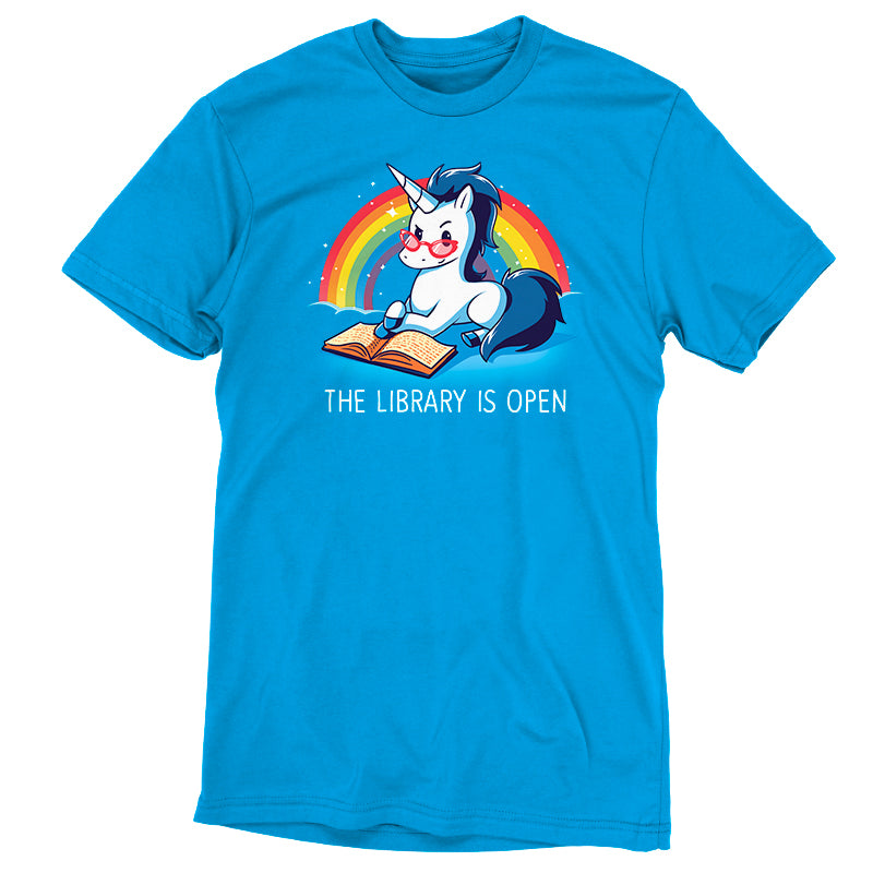 Discover enchantment with our cobalt blue t-shirt, boasting a cartoon unicorn reading a book against a rainbow backdrop. Made from Super Soft Ringspun Cotton, this "The Library is Open" by monsterdigital t-shirt promises both comfort and whimsy.