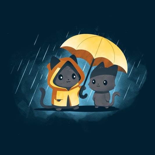 Two cartoon cats stand in the rain. One cat wears a yellow raincoat and holds a matching umbrella over both of them, creating a cheerful scene despite the weather. Both are printed on the monsterdigital Sharing Kindness unisex tee made from 100% super soft ringspun cotton for ultimate comfort.