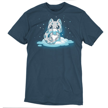 Premium Cotton T-shirt_TeeTurtle Snuggly Snow Leopard Denim t-shirt featuring a cartoon-style baby snow leopard with large eyes sitting on a cloud, hugging its tail, against a dark background with falling snowflakes. 