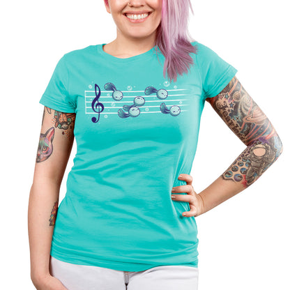 Premium Cotton T-shirt_Teeturtle Tadpool Tune caribbean blue t-shirt featuring a gaggle of adorable cartoon tadpoles swimming along a music score.