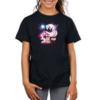 A young girl stands, smiling, wearing a Tale of Tails t-shirt in super soft ringspun cotton by monsterdigital, featuring colorful artwork of two mystical, fox-like creatures beneath a full moon.