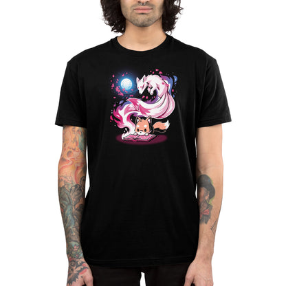 Person wearing a black unisex tee with a colorful graphic of a mystical fox and swirling shapes, standing against a plain background. This "Tale of Tails" t-shirt by monsterdigital is made from super soft ringspun cotton for ultimate comfort.
