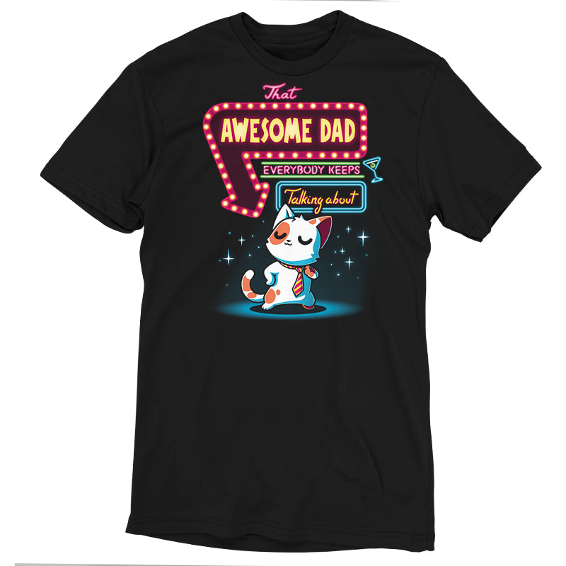 A black t-shirt made of super soft ringspun cotton features a cartoon cat with a scarf, beneath text reading "That Awesome Dad" by monsterdigital in brightly lit, marquee-style lettering.
