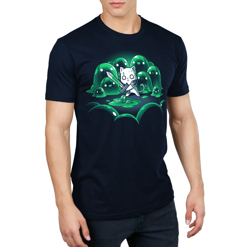 Person wearing "The Never-Ending Fight" by monsterdigital, a super soft ringspun cotton navy blue t-shirt with a graphic of a cat wielding a sword in front of green, blob-like creatures.