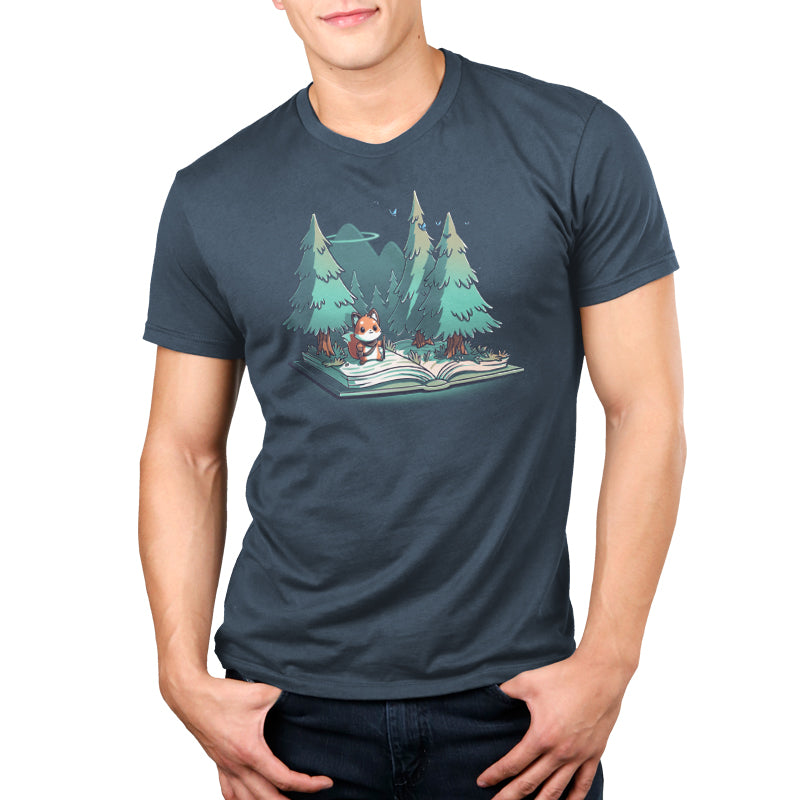 Premium Cotton T-shirt - A person wears a denim blue apparel featuring an illustration of a panda reading "The Adventurer's Tale" in a forest with UFOs in the background. The super soft ringspun cotton ensures maximum comfort. The Adventurer's Tale by monsterdigital is truly one-of-a-kind.