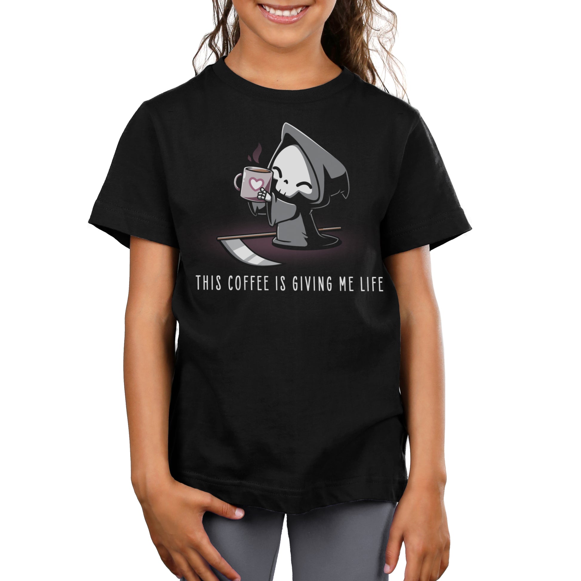 Premium Cotton T-shirt - A child wearing a super soft ringspun cotton black apparel from monsterdigital featuring a cartoon grim reaper holding a coffee cup and the text "This Coffee Is Giving Me Life.