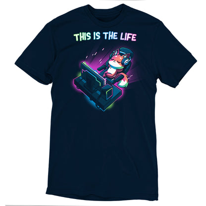 A navy blue gaming t-shirt from monsterdigital features a colorful graphic of a cartoon fox wearing headphones, standing on a retro-style console. The text "This Is the Life" is displayed above the graphic.
