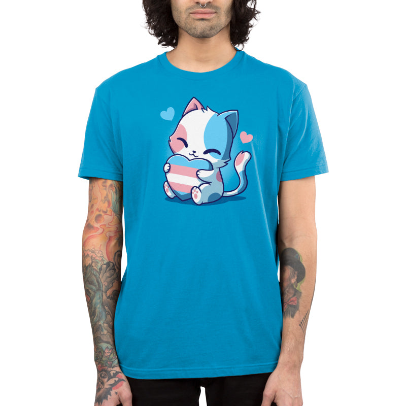 Premium Cotton T-shirt - Person wearing a cobalt blue Trans Purride apparel by monsterdigital with an illustration of a cute, smiling cat holding a controller and surrounded by small hearts. Made from super soft ringspun cotton, the apparel pairs well with the tattoos on their arms to create a unique look that subtly champions trans rights.