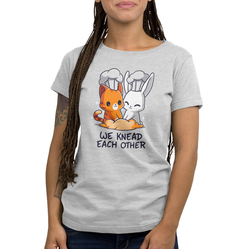 Premium Cotton T-shirt - Person wearing a light gray monsterdigital We Knead Each Other apparel with a graphic of a cat and rabbit in chef hats kneading dough, and the text "We knead each other." Crafted from super soft ringspun cotton.