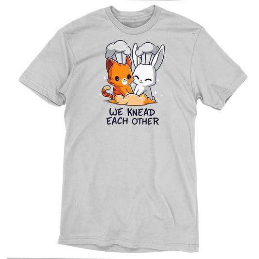 A gray T-shirt featuring an illustration of a cat and a rabbit wearing chef hats, kneading dough together, with the text 