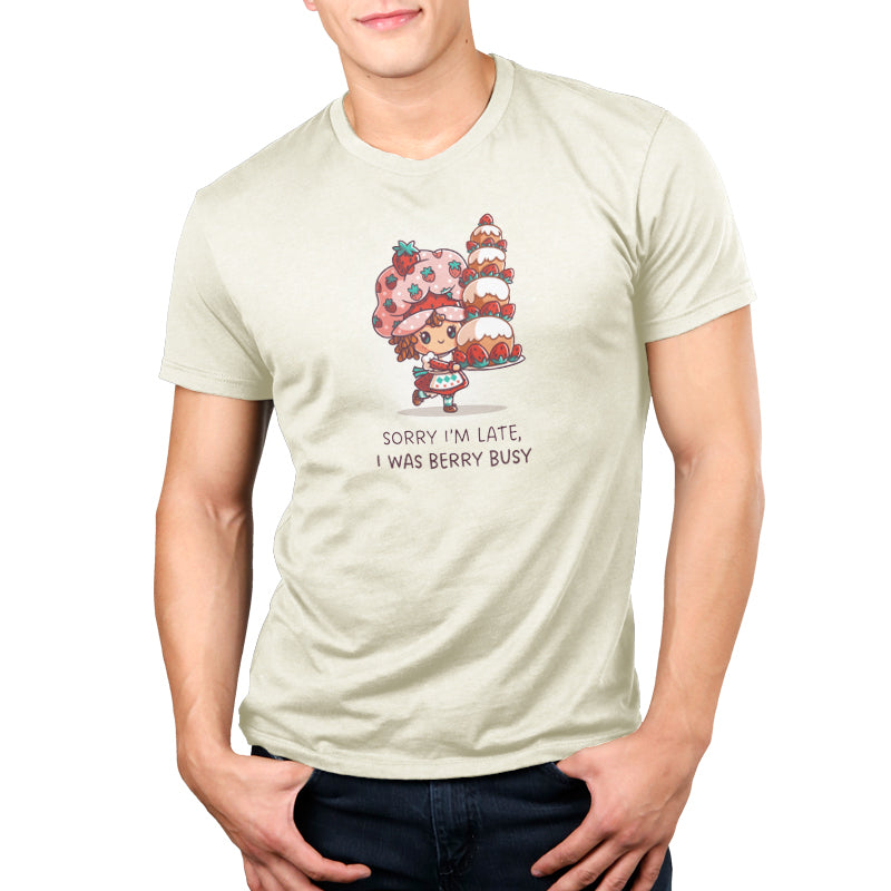 Premium Cotton T-shirt_TeeTurtle natural heather Sorry I Was Late, I Was Berry Busy apparel featuring Strawberry Shortcake holding a tall, large strawberry cake, and the caption, "Sorry I Was Late, I Was Berry Busy".