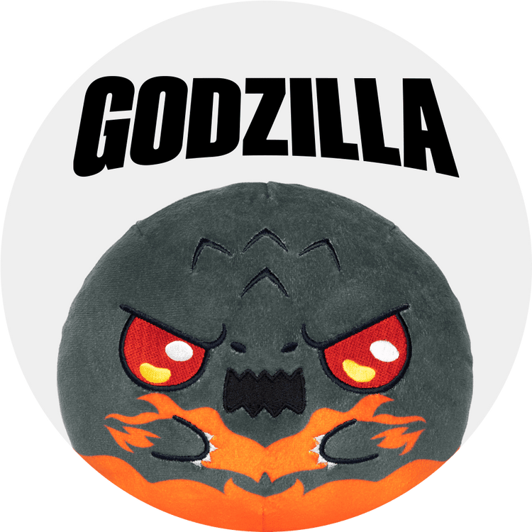 Plush toy with Godzilla design on a white background