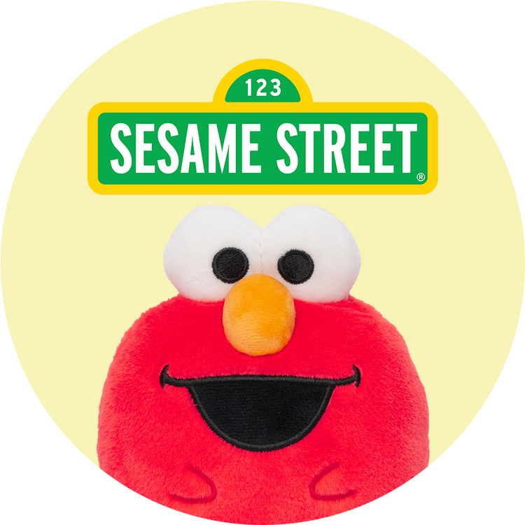 Plush toy with a Sesame Street character face on a yellow background