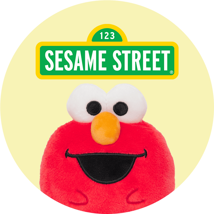 Plush toy with a Sesame Street character face on a yellow background