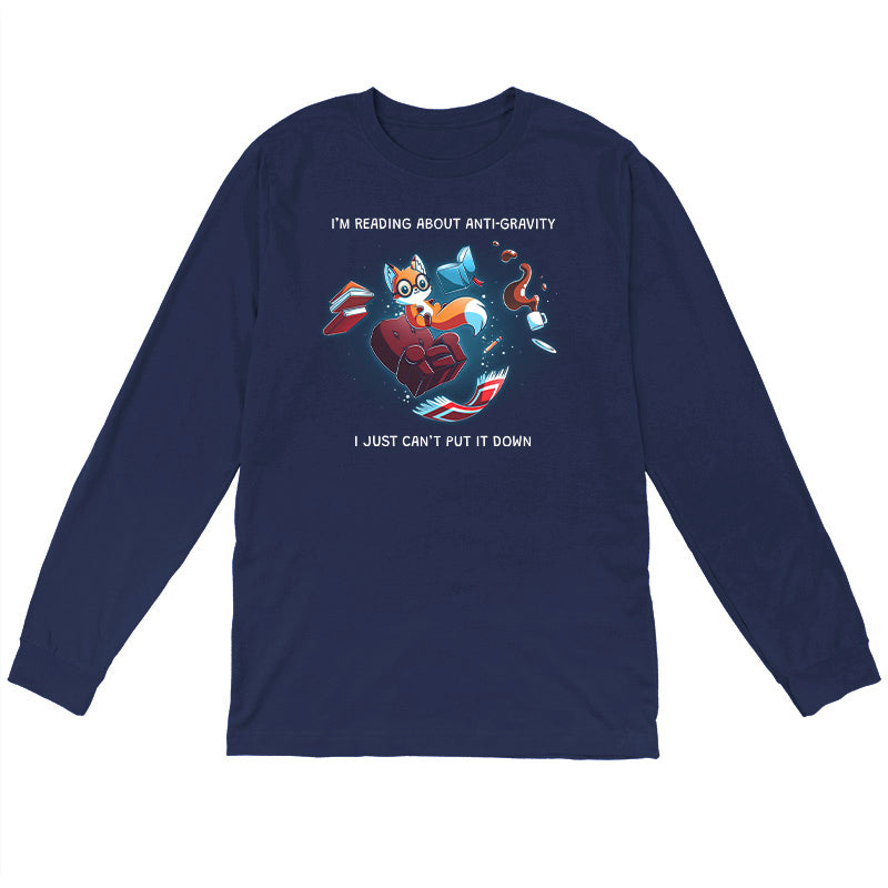 Long Sleeve T-shirt_TeeTurtle navy blue Anti-Gravity Enthusiast apparel featuring a fox wearing glasses reading a book with floating in mid-air with its living room furniture, such as a chair, rug, and lamp, with the caption, “I’m Reading About Anti-Gravity, I Just Can’t Put It Down“.