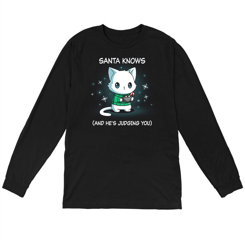 Long Sleeve T-shirt_TeeTurtle black Santa Knows apparel featuring a cat with a deadpan expression holding mug with hot chocolate, marshmallows, and a candy cane surrounded by snowflakes, with the caption, “Santa Knows (And He’s Judging You)“.