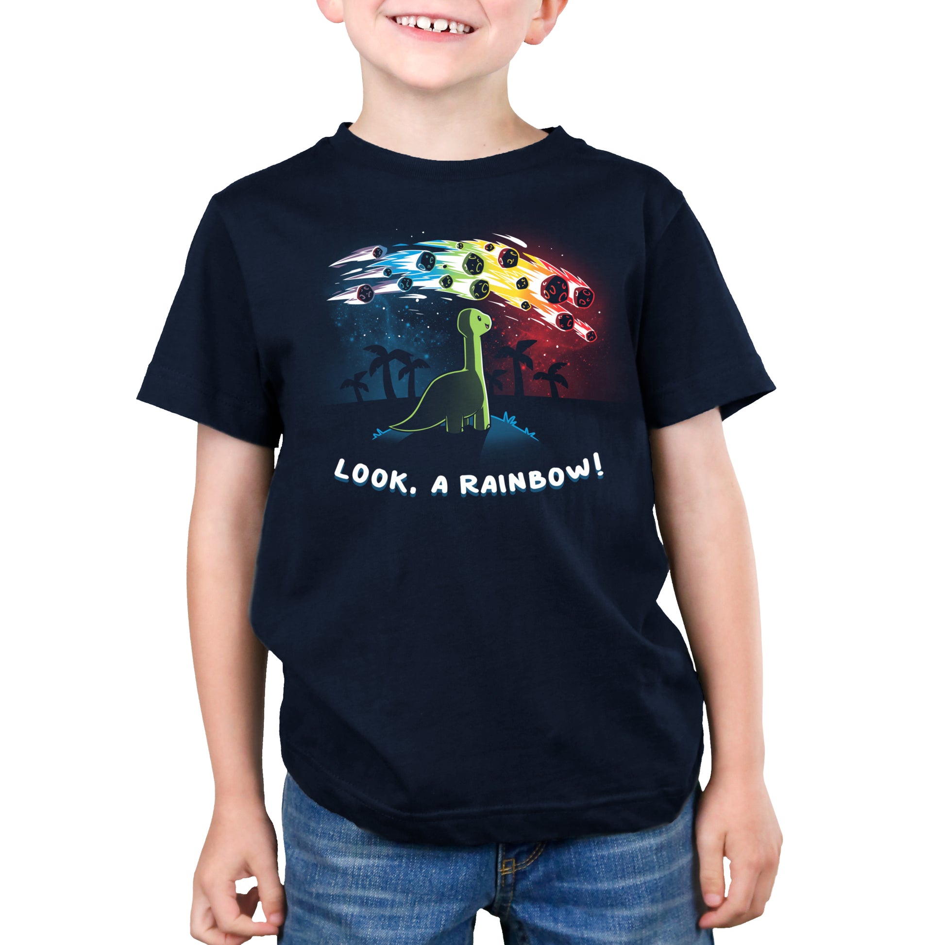 A young boy wearing a navy blue t-shirt with TeeTurtle's Look, a Rainbow! design.