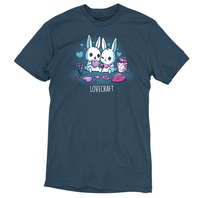 Premium Cotton T-shirt_TeeTurtle denim blue Lovecraft Bunnies Premium Cotton T-shirt featuring two bunnies doing love-themed crafts with hearts in the back and a caption that reads, "lovecraft".