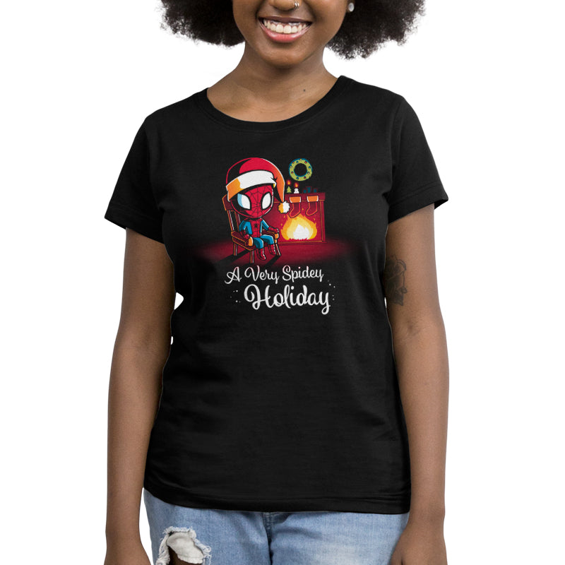 A woman wearing a black Marvel Spider-Man t-shirt called "A Very Spidey Holiday".