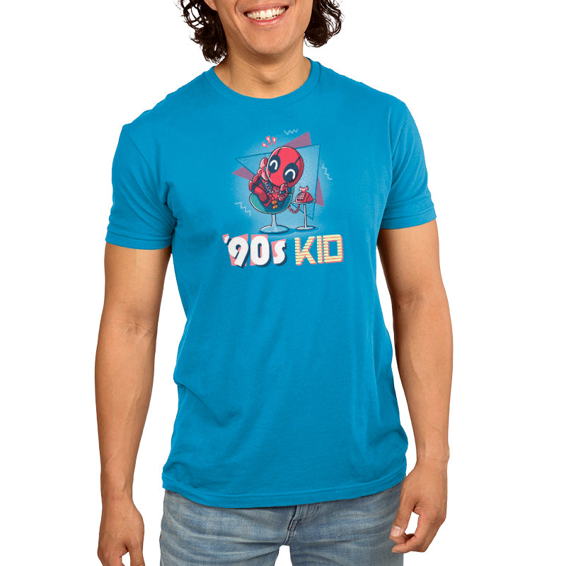 A man wearing a blue t-shirt that says Marvel's '90s Kid.