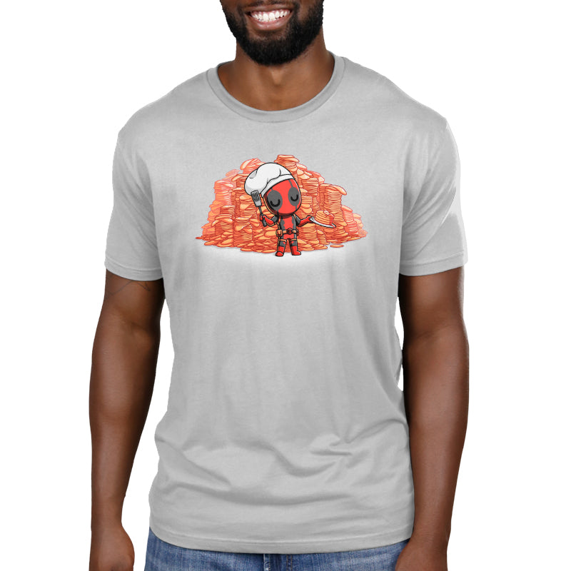 A man proudly dons a Marvel-inspired t-shirt featuring Deadpool Loves Pancakes.