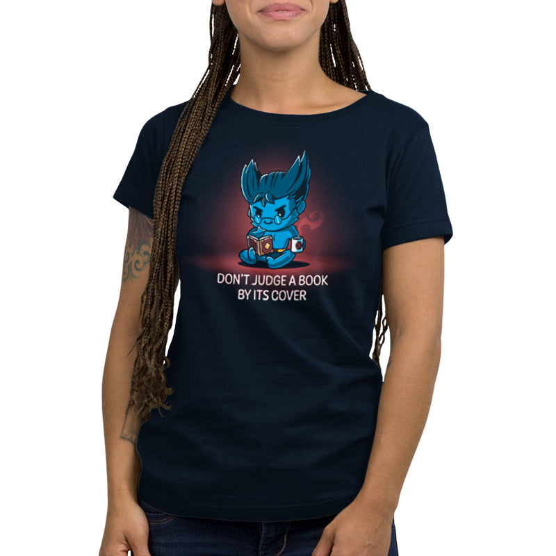 A woman wearing a blue t-shirt with a blue dragon on it and officially licensed Marvel's "Don't Judge a Book By Its Cover (Beast)" products.