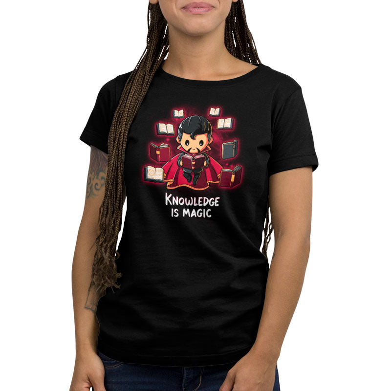 A woman wearing a black Knowledge Is Magic T-shirt by Marvel.
