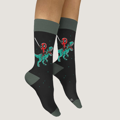 A woman wearing officially licensed Marvel socks with Deadpool riding a Raptor.