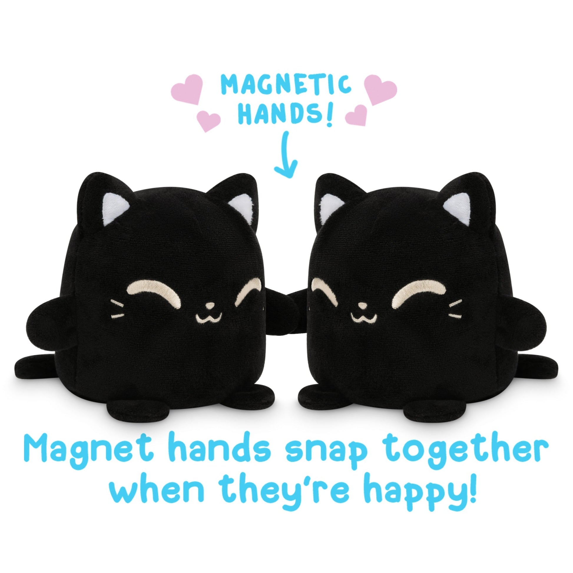 Two TeeTurtle Black Reversible Cat Plushmates, with magnetic hands that snap together when they're happy.