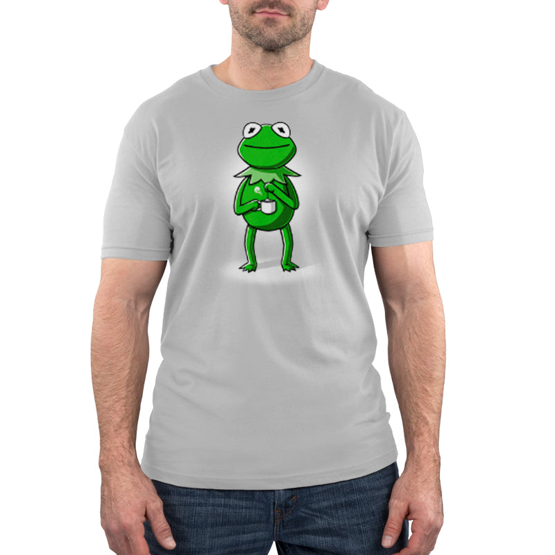 A man wearing a licensed Kermit's Tea t-shirt from Disney.