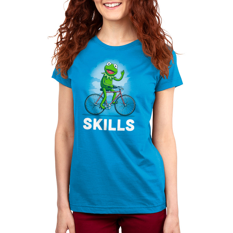 Officially licensed Disney Kermit Skills T-shirt featuring a frog riding a bicycle showcasing its skills.