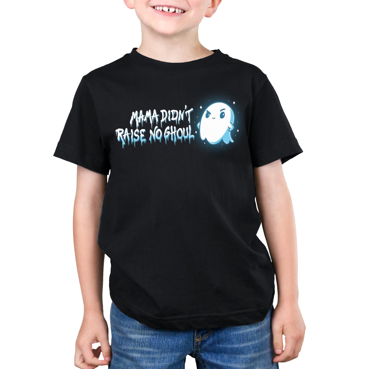 A young boy wearing a limited stock black TeeTurtle Mama Didn't Raise No Ghoul T-shirt that says 'trick or treat'.
